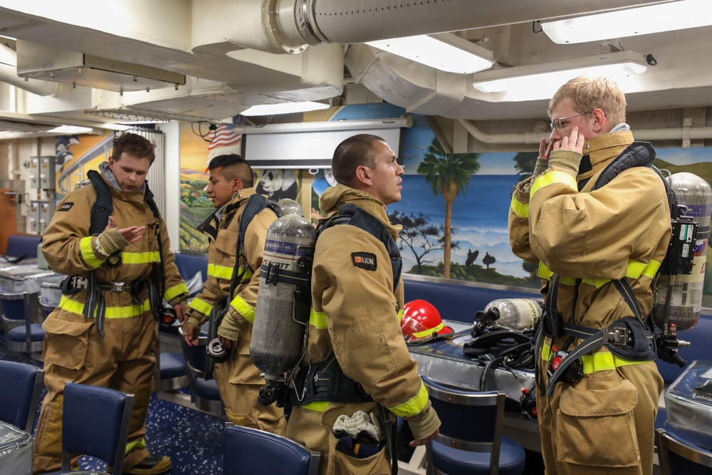 Sailors aboard the USS Howard conduct a general quarters drill in the South China Sea