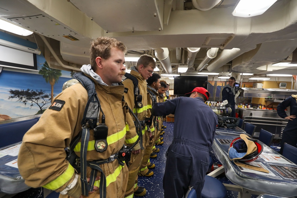 Sailors aboard the USS Howard conduct a general quarters drill in the South China Sea