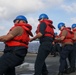Sailors aboard the USS Howard conduct a replenishment-at-sea with the USNS Rappahannock in the South China Sea