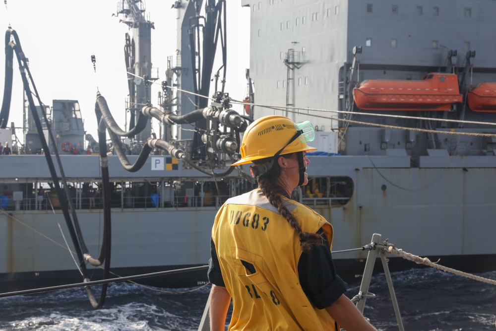 Sailors aboard the USS Howard conduct a replenishment-at-sea with the USNS Rappahannock in the South China Sea
