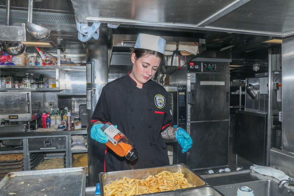 Sailors aboard the USS Howard prepare lunch for the crew in the South China Sea