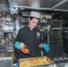 Sailors aboard the USS Howard prepare lunch for the crew in the South China Sea