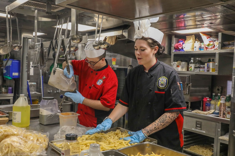 Sailors aboard the USS Howard prepare lunch for the crew in the South China Sea