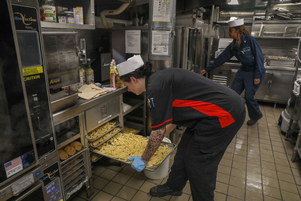 Sailors aboard the USS Howard prepare lunch for the crew in the South China Sea