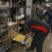 Sailors aboard the USS Howard prepare lunch for the crew in the South China Sea