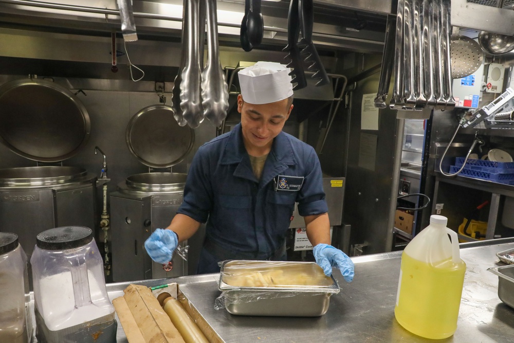 Sailors aboard the USS Howard prepare lunch for the crew in the South China Sea