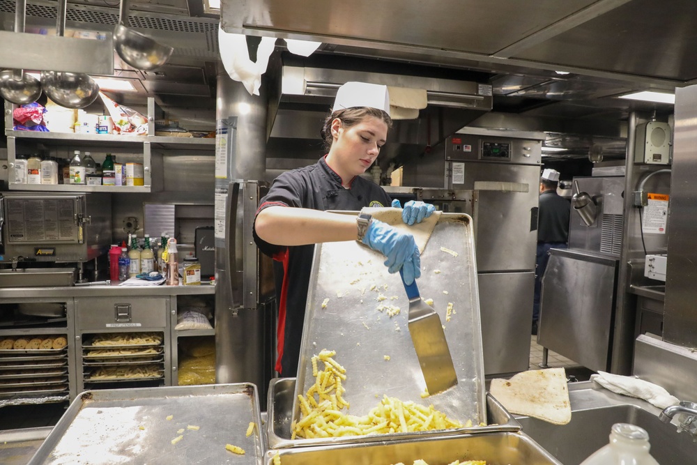 Sailors aboard the USS Howard prepare lunch for the crew in the South China Sea