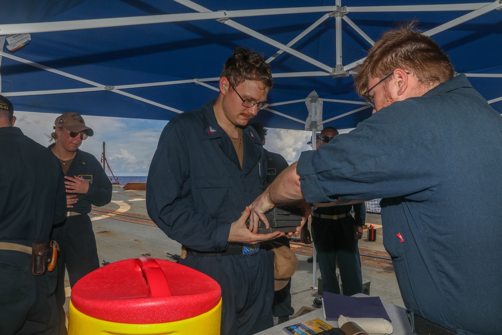 Sailors aboard the USS Howard conduct a small arms gunshoot in the South China Sea