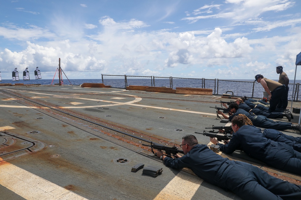 Sailors aboard the USS Howard conduct a small arms gunshoot in the South China Sea