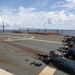 Sailors aboard the USS Howard conduct a small arms gunshoot in the South China Sea