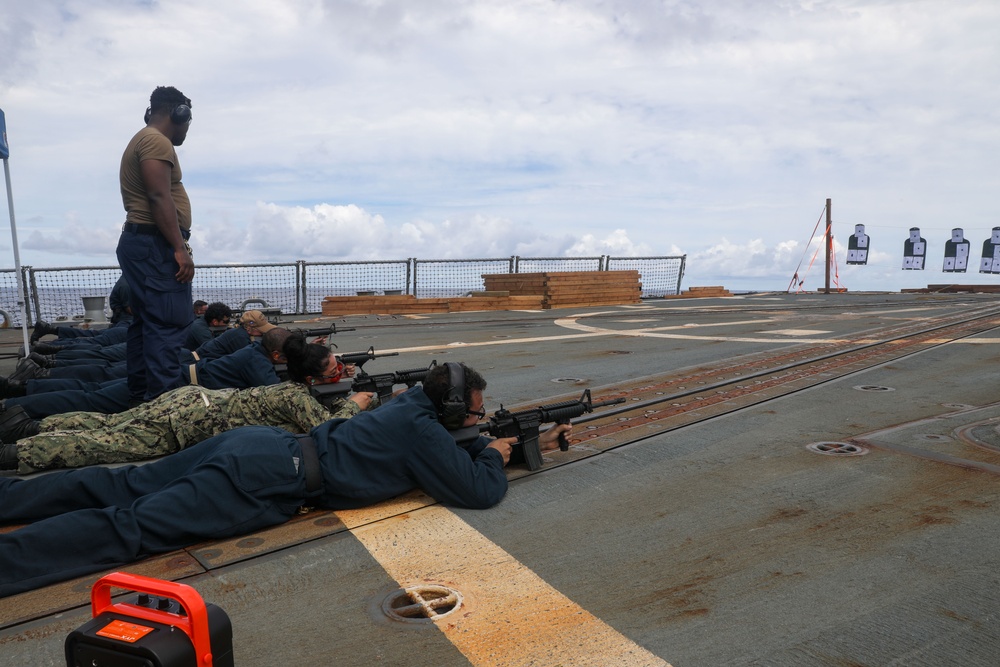 Sailors aboard the USS Howard conduct a small arms gunshoot in the South China Sea