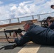 Sailors aboard the USS Howard conduct a small arms gunshoot in the South China Sea