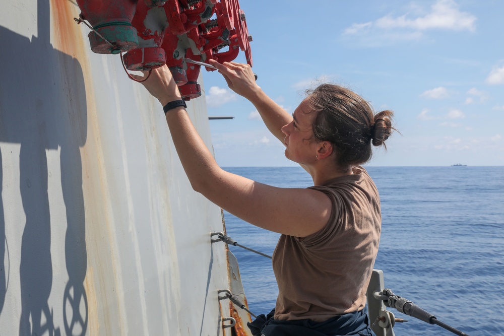 Sailors aboard the USS Howard conduct ship preservation efforts in the South China Sea