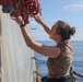 Sailors aboard the USS Howard conduct ship preservation efforts in the South China Sea