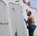 Sailors aboard the USS Howard conduct ship preservation efforts in the South China Sea