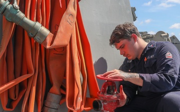 Sailors aboard the USS Howard conduct ship preservation efforts in the South China Sea