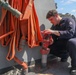 Sailors aboard the USS Howard conduct ship preservation efforts in the South China Sea