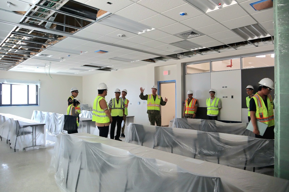 CAPT Blake Burket Leads a Tour of Communal Spaces Nearing Completion on Marine Corps Base Camp Blaz