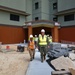 CAPT Blake Burket Leads a Site Tour of Bachelor Enlisted Quarter Under Construction