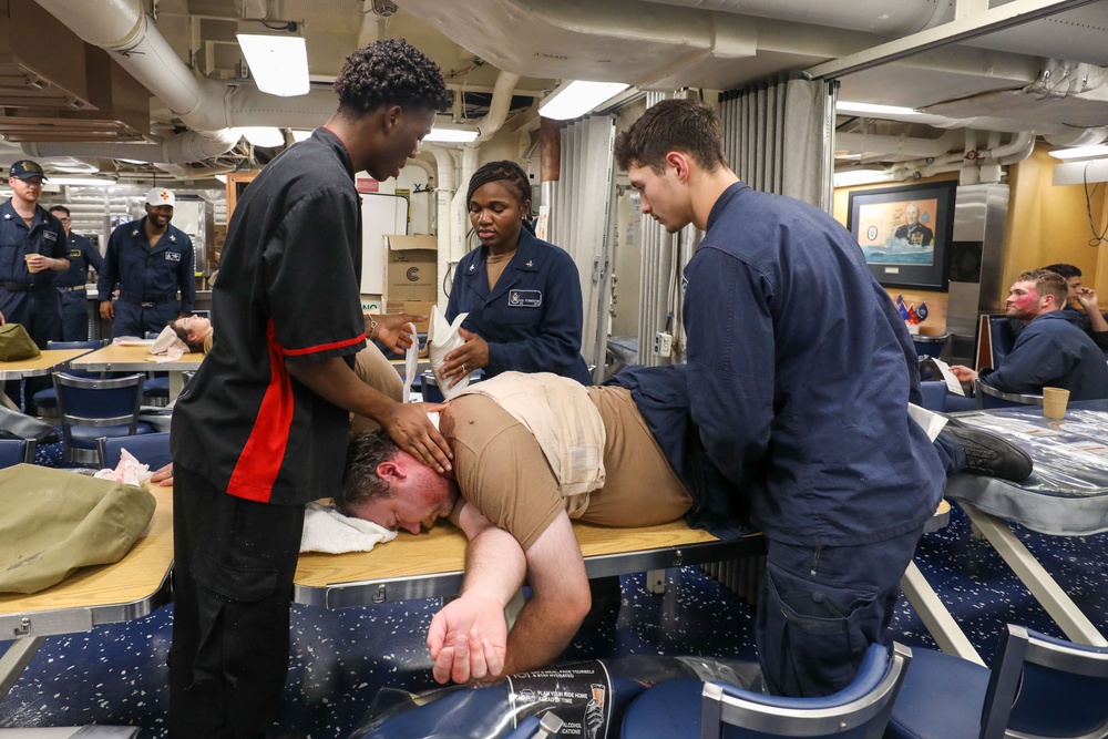 Sailors aboard the USS Howard conduct an integrated training team drill in the South China Sea