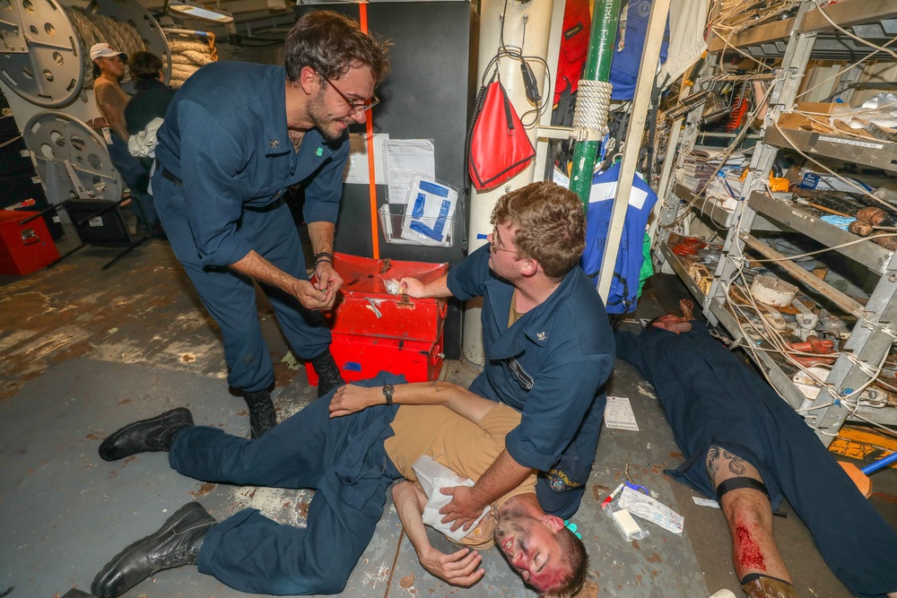 Sailors aboard the USS Howard conduct an integrated training team drill in the South China Sea