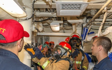 Sailors aboard the USS Howard conduct an integrated training team drill in the South China Sea