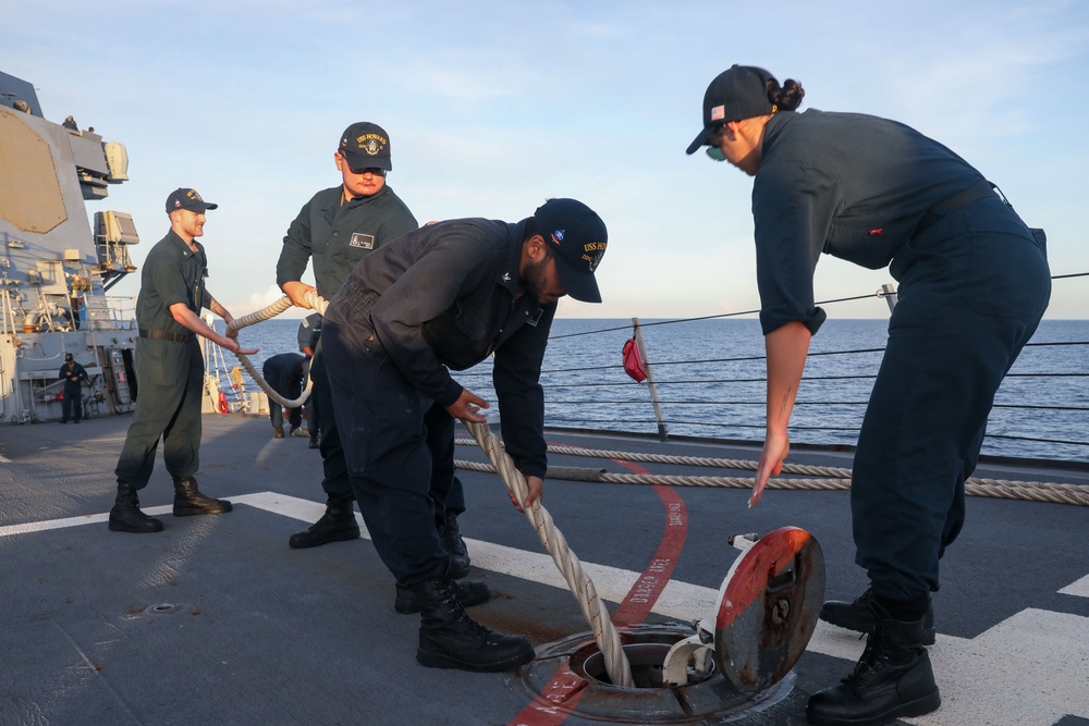 Sailors aboard the USS Howard conduct a sea and anchor detail in Subic, Philippines