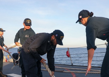 Sailors aboard the USS Howard conduct a sea and anchor detail in Subic, Philippines