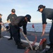 Sailors aboard the USS Howard conduct a sea and anchor detail in Subic, Philippines