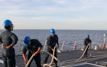 Sailors aboard the USS Howard conduct a sea and anchor detail in Subic, Philippines