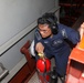 Sailors aboard the USS Howard conduct an engineering training team drill in the South China Sea