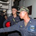 Sailors aboard the USS Howard conduct an engineering training team drill in the South China Sea