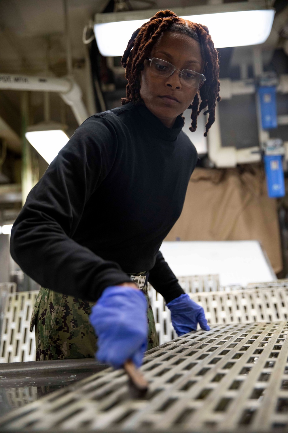 USS George H.W. Bush Sailors clean the ship