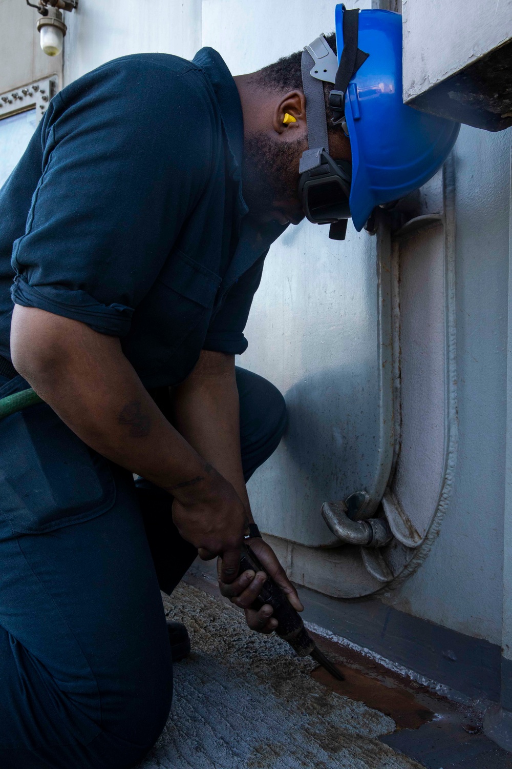 USS George H.W. Bush Sailors clean the ship