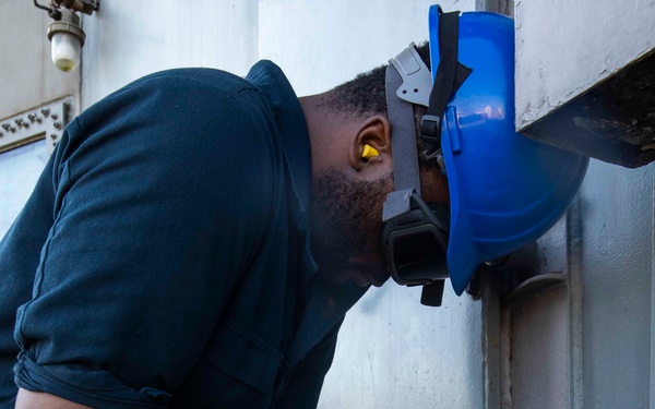 USS George H.W. Bush Sailors clean the ship
