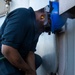 USS George H.W. Bush Sailors clean the ship