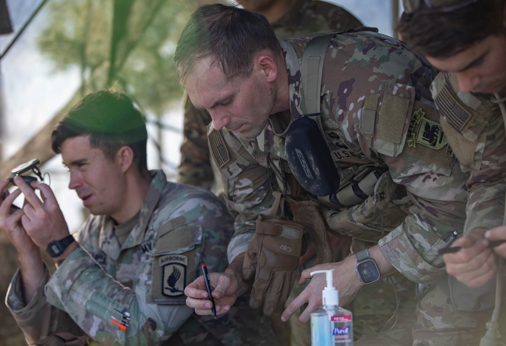 Soldiers practice resection and navigation techniques during E3B