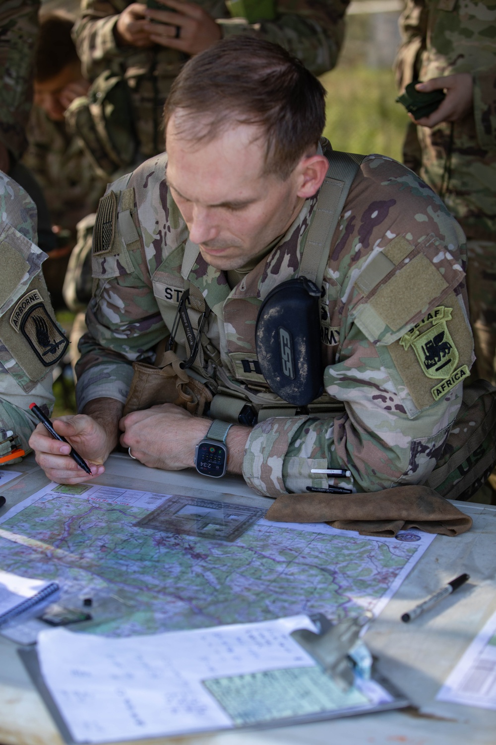 Soldiers practice resection and navigation techniques during E3B