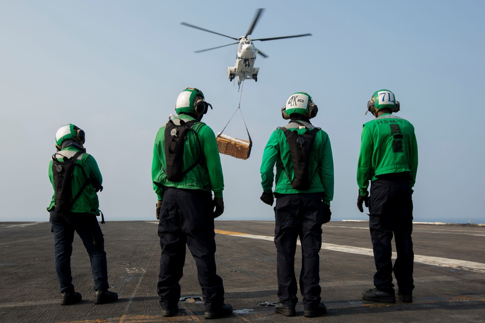 Abraham Lincoln conducts a replenishment-at-sea with Amelia Earhart