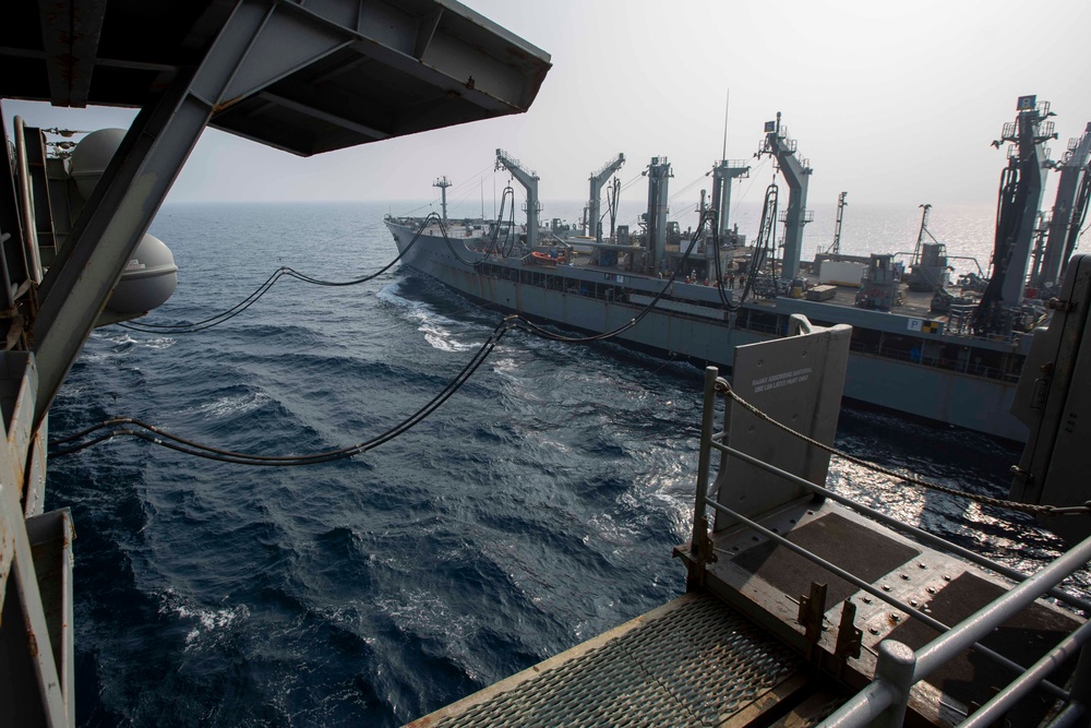 Abraham Lincoln conducts a replenishment-at-sea with Rappahannock