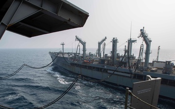 Abraham Lincoln conducts a replenishment-at-sea with Rappahannock