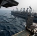 Abraham Lincoln conducts a replenishment-at-sea with Rappahannock