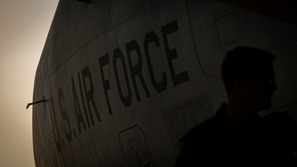 Golden light, ready flight: Airmen prep a KC-135 for takeoff at sunset