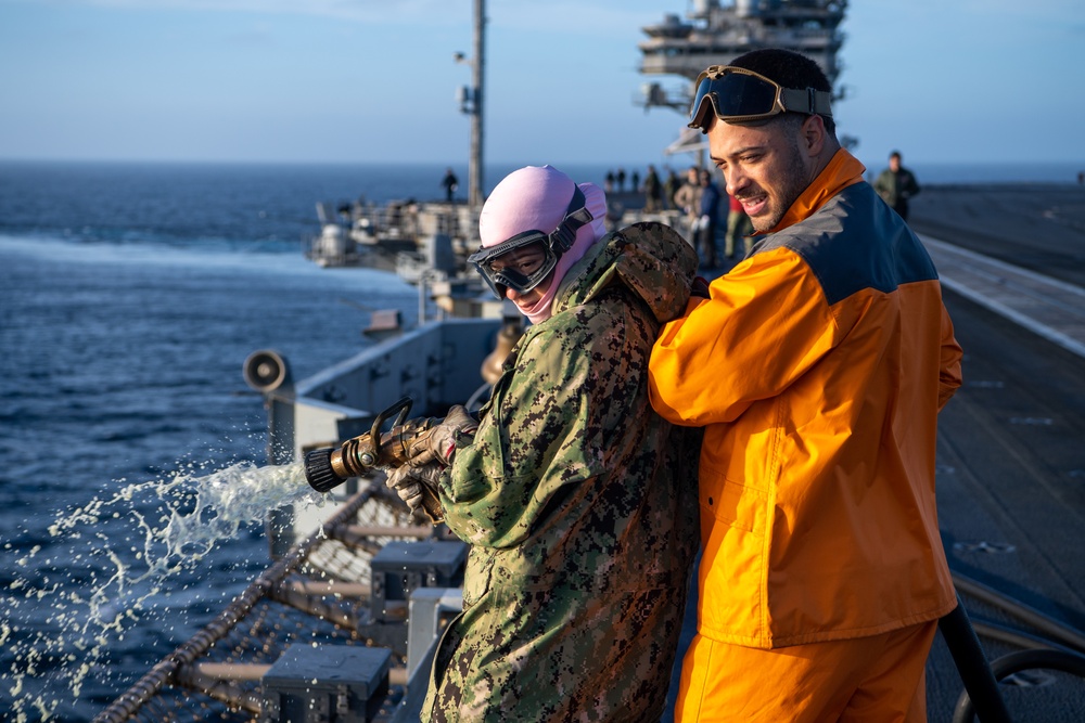 USS Ronald Reagan (CVN 76) conducts a counter-measure washdown