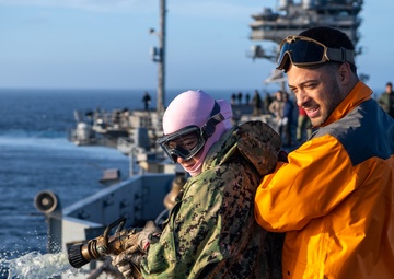 USS Ronald Reagan (CVN 76) conducts a counter-measure washdown