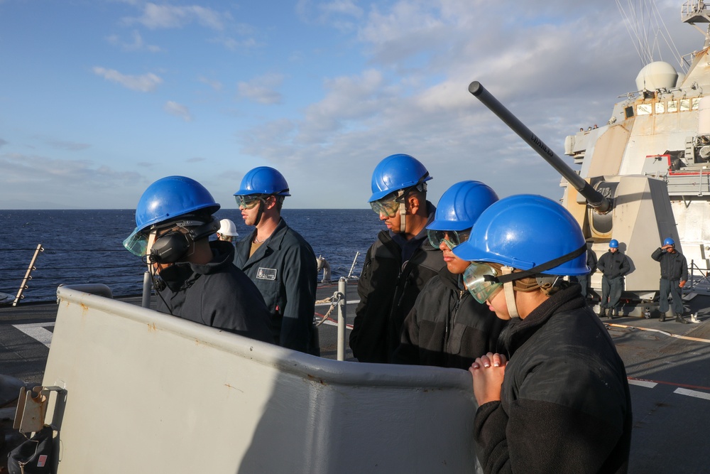 Sailors aboard the USS Howard conduct a sea and anchor detail in Yokosuka, Japan