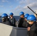 Sailors aboard the USS Howard conduct a sea and anchor detail in Yokosuka, Japan