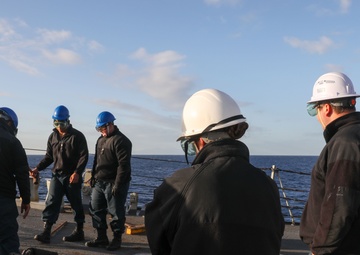 Sailors aboard the USS Howard conduct a sea and anchor detail in Yokosuka, Japan