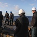 Sailors aboard the USS Howard conduct a sea and anchor detail in Yokosuka, Japan