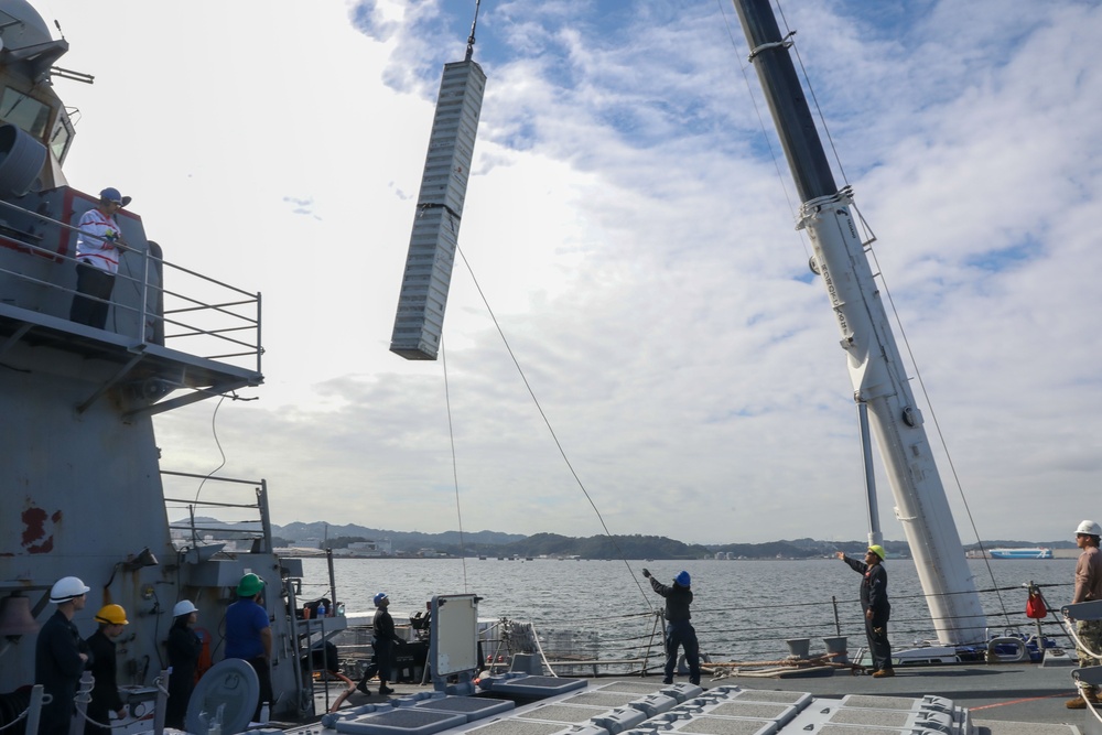 Sailors aboard the USS Howard conduct an ammo offload in Yokosuka, Japan